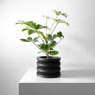 3D printed plant pot with unique layered design, perfect for home decor and indoor plants.