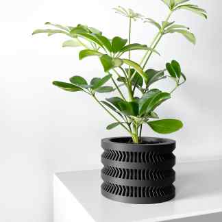 Stylish 3D printed plant pot with geometric patterns, perfect for modern home decor and indoor plants.