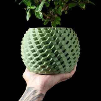 Unique 3D printed geometric flower pot with intricate pattern, ideal for modern home decor and plant display.