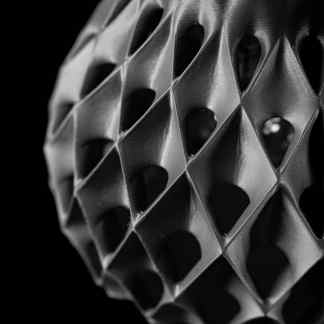 Highly detailed black and white 3D printed geometric design.
