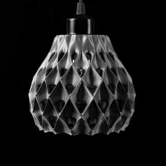 A sleek 3D-printed pendant light with a geometric honeycomb design, perfect for contemporary interiors.
