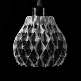 High-resolution black and white photo of a 3D printed geometric pendant lamp.