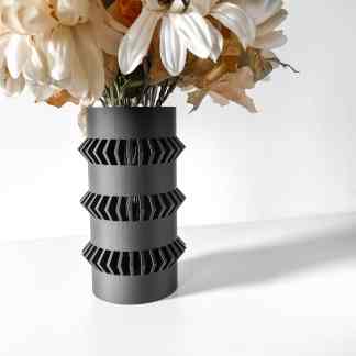 Stylish black 3D printed vase with artificial flowers, emphasizing modern home decor and 3D printing craftsmanship.