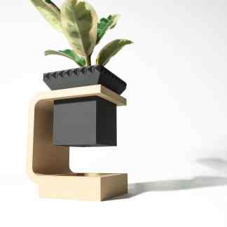 Stylish 3D-printed plant holder with abstract geometric form, designed by AM Square 3D.