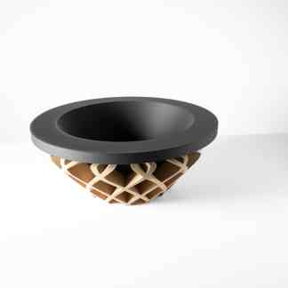 A modern 3D printed bowl featuring black and beige geometric patterns, highlighting advanced 3D printing technology.