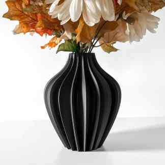 Elegant black 3D-printed vase with fall foliage and flowers for stylish home decor.
