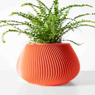 Colorful 3D-printed flower pot with detailed ribbed pattern on a white background.