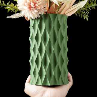 3D printed green vase with geometric design, holding flowers for stylish home decor.