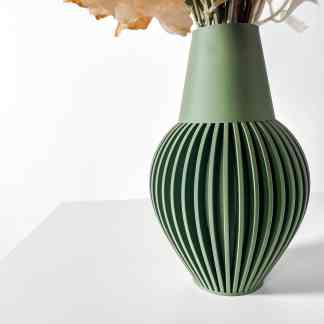 Magnetic green vase with ribbed detailing, perfect for stylish home interior accents.
