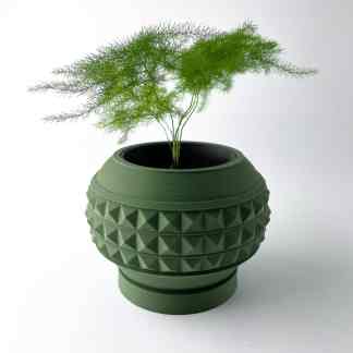 Vase featuring intricate geometric patterns, with a vibrant fern plant for modern decor.