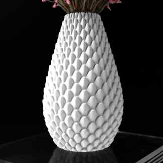 Colorful floral arrangement in a textured white vase.