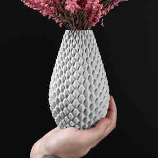 Vase with detailed pink flowers against black background, showcasing modern 3D ceramic design.