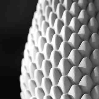 Highly detailed 3D printed white object showcasing advanced geometric design.