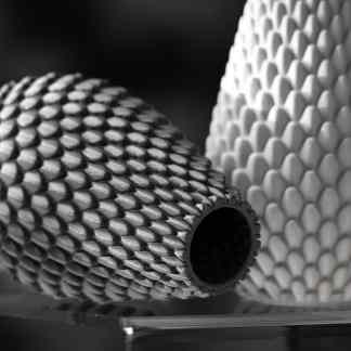 Close-up of textured 3D printed objects showcasing precision and surface detail.