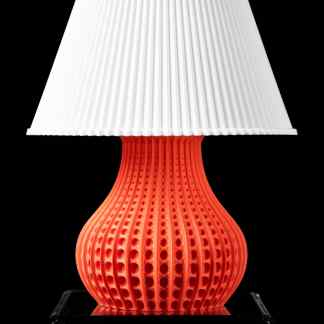 High-quality 3D printed table lamp featuring a vibrant red base with detailed pattern and a sleek white lampshade, exemplifying advanced 3D printing design.