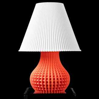 A modern 3D-printed table lamp with a textured white lampshade and a vibrant red base, showcasing innovative 3D printing design.
