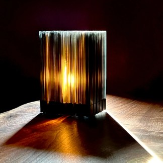 Detailed, artistic 3D printed lamp with glowing light effect.