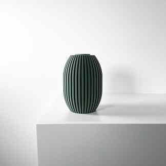 Elegant green ceramic vase with textured vertical lines, modern home decor piece.