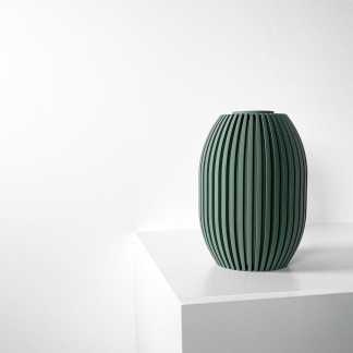 Elegant green ceramic vase with vertical slats, perfect for contemporary interior design accents.