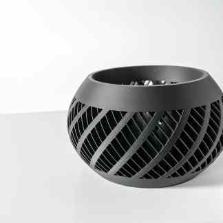 A stylish black 3D printed geometric vase with open lattice design, perfect for modern home decor.