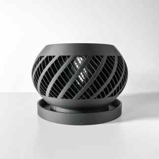 Custom 3D printed black diffuser with intricate lattice design for lighting and decorative purposes.
