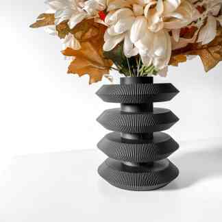 3D printed black vase with textured geometric patterns for stylish home decor and flower arrangements.