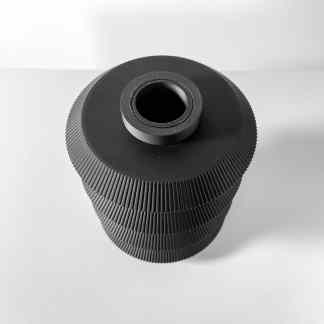 Close-up of a black 3D printed mechanical roller with textured surface for precise industrial applications.
