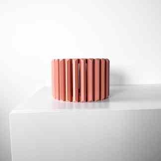 Sleek pink 3D geometric wall decor for contemporary interior design.