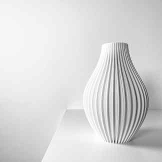 Stylish white 3D printed vase with vertical ridges, modern home decor sculpture.