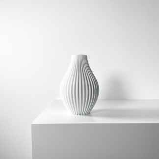 Elegant white ceramic vase with vertical ridges, perfect for home decor or artistic displays.