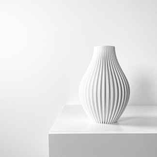 Elegant 3D printed ceramic vase with unique ribbed texture and contemporary style.