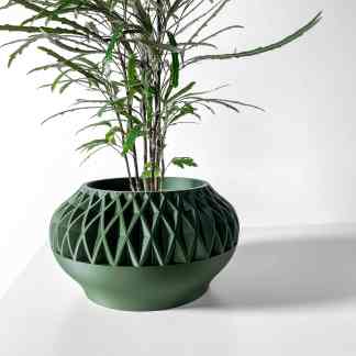 Stylish green ceramic planter with intricate 3D geometric patterns for indoor plants.