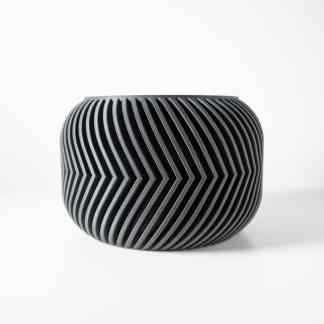 Stylish black geometric vase showcasing innovative 3D printing design, perfect for modern home decor.