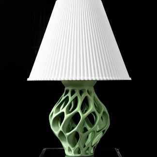 Unique 3D-printed lamp with intricate green base and white textured lampshade, innovative design, perfect for contemporary interiors.