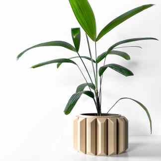 Decorative indoor plant in contemporary beige vase, lush green foliage, simple modern interior decor.