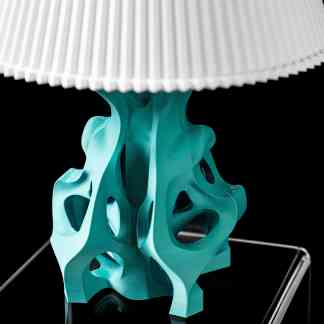 High-detail turquoise 3D-printed architectural model on black background.