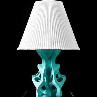Alt text: Contemporary 3D-printed table lamp with intricate turquoise base and white lampshade.