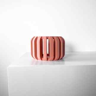 Elegant pink 3D-printed decorative sculpture on white surface for contemporary interior design.