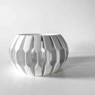 A sleek, white 3D-printed geometric vase showcasing intricate modular design, perfect for modern interior styling.
