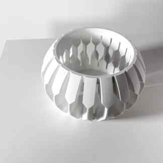 High-quality 3D-printed ring with geometric cutouts, showcasing advanced additive manufacturing technology.