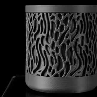 Intricate black 3D-printed sculpture with organic, flowing patterns, showcasing advanced 3D printing technology and artistic craftsmanship.