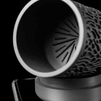 High-resolution 3D printed cylinder with detailed surface patterns, ideal for prototyping and custom designs.