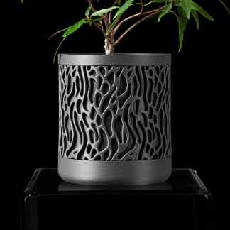 Detailed, artistic 3D-printed plant pot showcasing innovative technology.