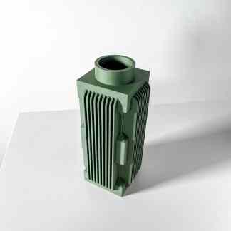 A sleek, green 3D-printed industrial component with detailed fin design, showcasing advanced additive manufacturing technology.