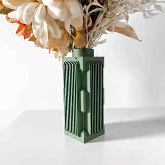 Elegant green 3D-printed vase holding mixed artificial flowers on a white background.