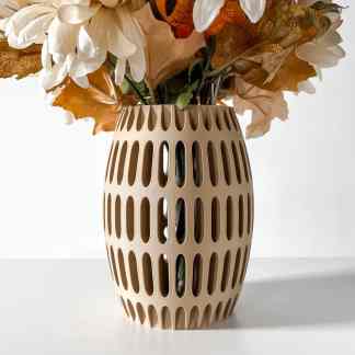 Vase with modern wooden lattice pattern holding an arrangement of autumn leaves and flowers.