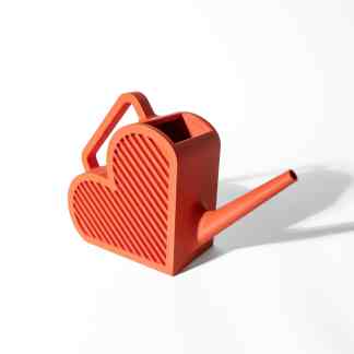 Miniature heart-shaped watering can in bright red, ideal for small plants or decorative gardening displays.