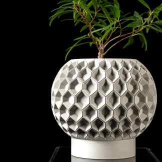 Modern 3D-printed geometric flowerpot, showcasing intricate honeycomb pattern and sleek design.