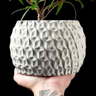 Elegant white textured plant pot ideal for home decor and interior design.