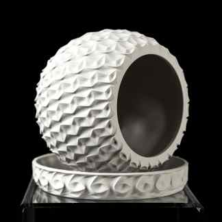 3D-printed golf ball featuring intricate surface design for enhanced aerodynamics and performance.